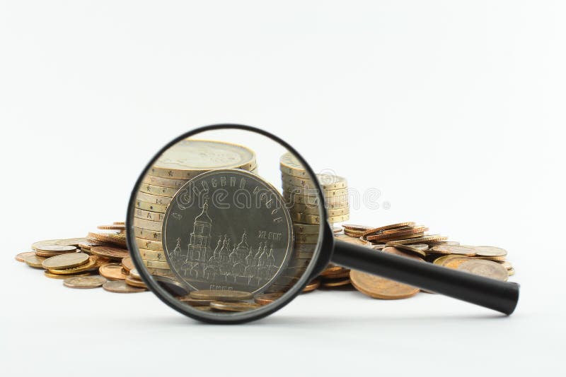 Magnifying glass and coins stock image. Image of money 5759353