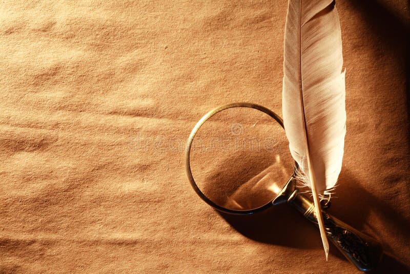 Magnifying Glass And Feather