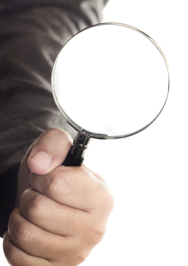 Closeup Of Womans Hand Holding Magnifying Lens High-Res Stock