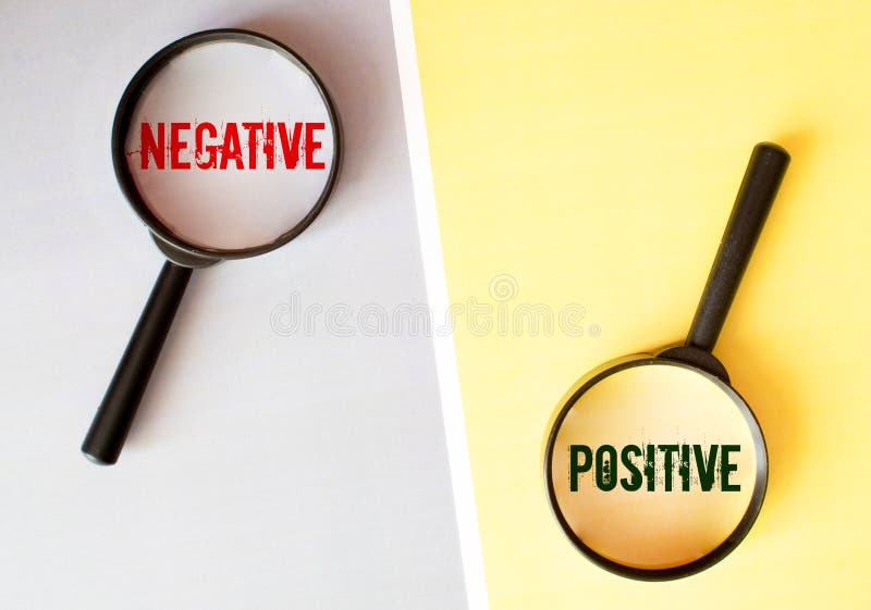 Magnifying Glass On Missing Puzzle with POSITIVE NEGATIVE Word, Antonym Concept and Selective Focus stock photos