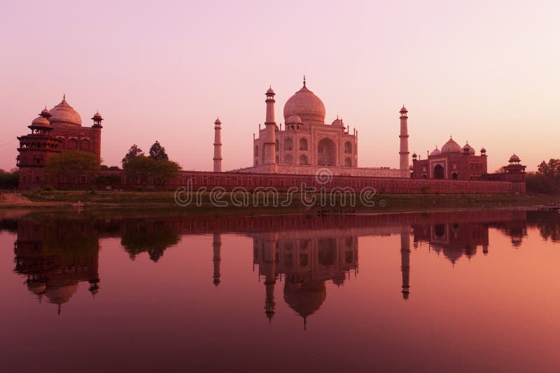 The Taj Mahal at sunset reflected in the Yamuna river. The Taj Mahal at sunset reflected in the Yamuna river.