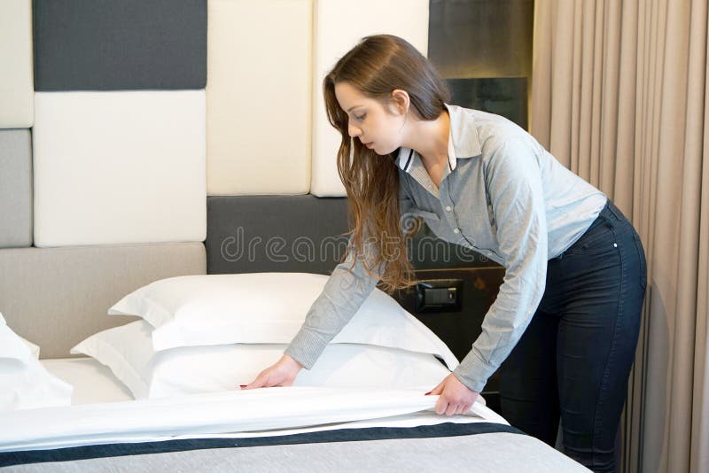 Maid Making Bed stock image. Image of cleans, interior 116555353