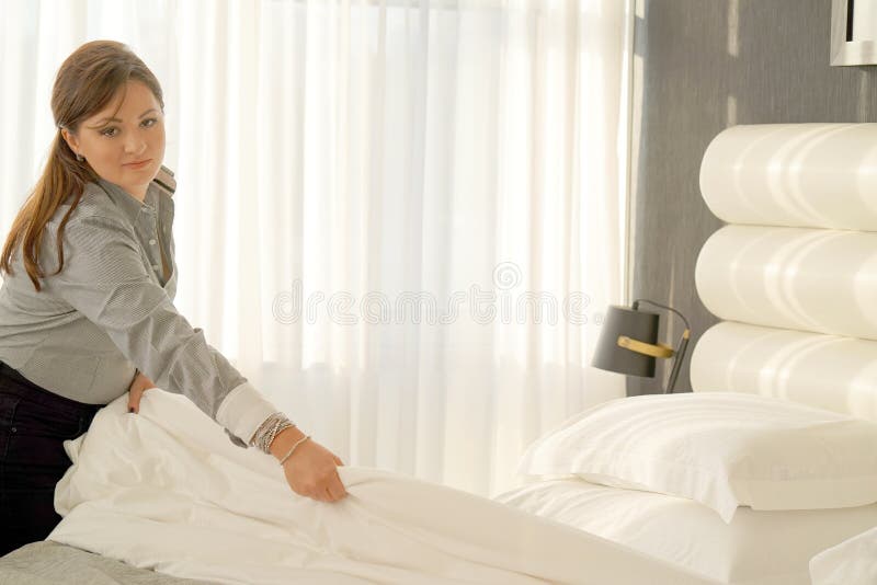 Maid Making Bed stock image. Image of interior, domestic 150774711