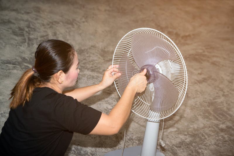 The Maidservant is Assembling and Installing an Electric Fan after