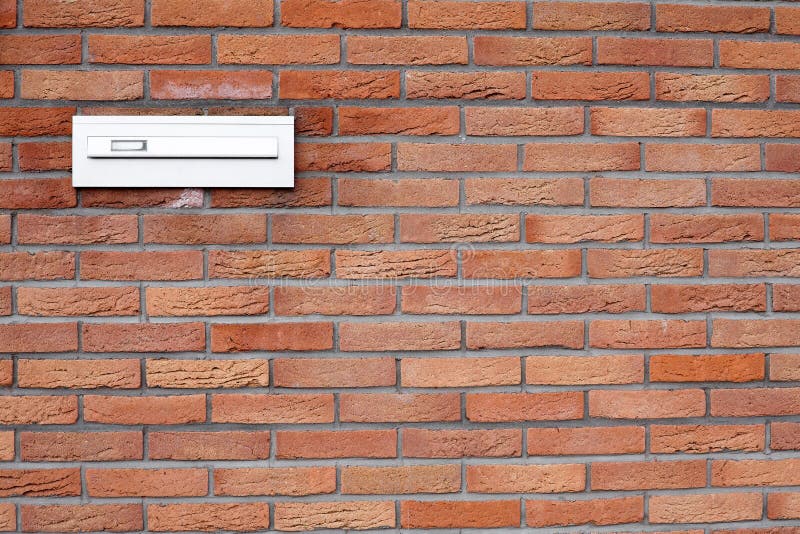 Mailbox in a brick wall stock image. Image of antique 19208263