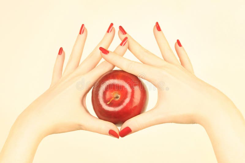 Main avec la pomme rouge image stock Main avec la pomme rouge image stock