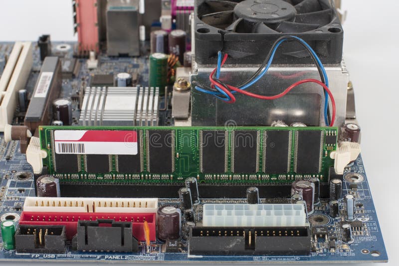 Main board of old desktop computer, close up of memory module in slot on motherboard stock image Main board of old desktop computer, close up of memory module in slot on motherboard stock image