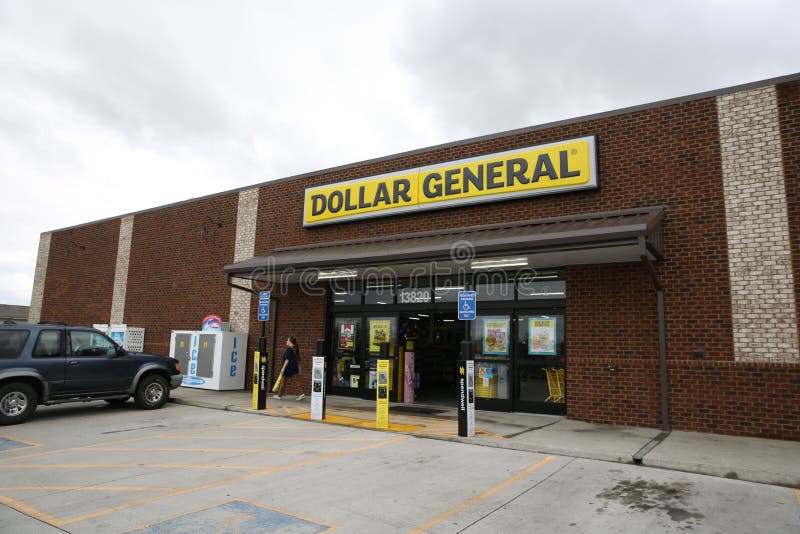 Main Entrance of a Dollar General with Overcast Clouds in the Sky