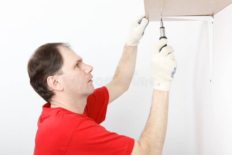 Main installing the shelf stock image
