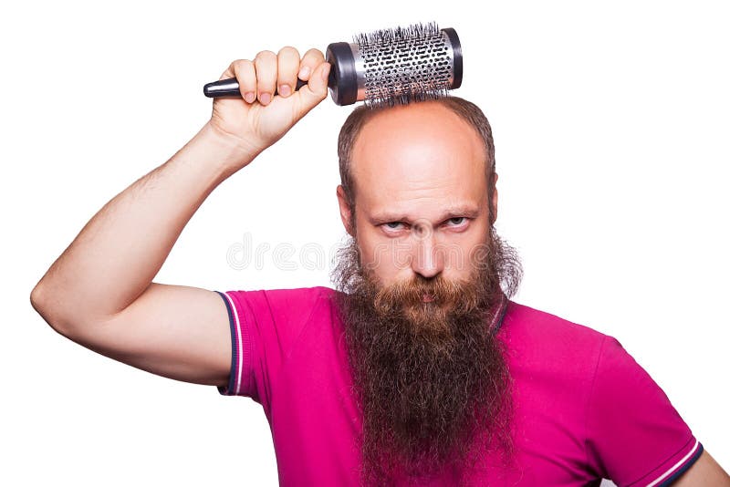 Main malheureuse adulte d'homme tenant le peigne sur la tête chauve photo stock Main malheureuse adulte d'homme tenant le peigne sur la tête chauve photo stock