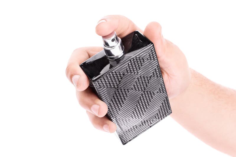 Main masculine tenant une bouteille de parfum noire image stock Main masculine tenant une bouteille de parfum noire image stock