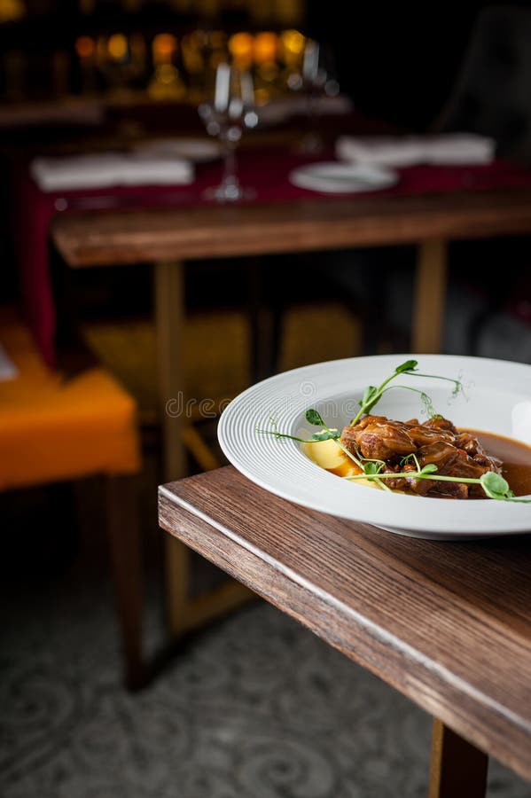 The Main Meat Dish on a Large Deep Plate. Restaurant Stock Image