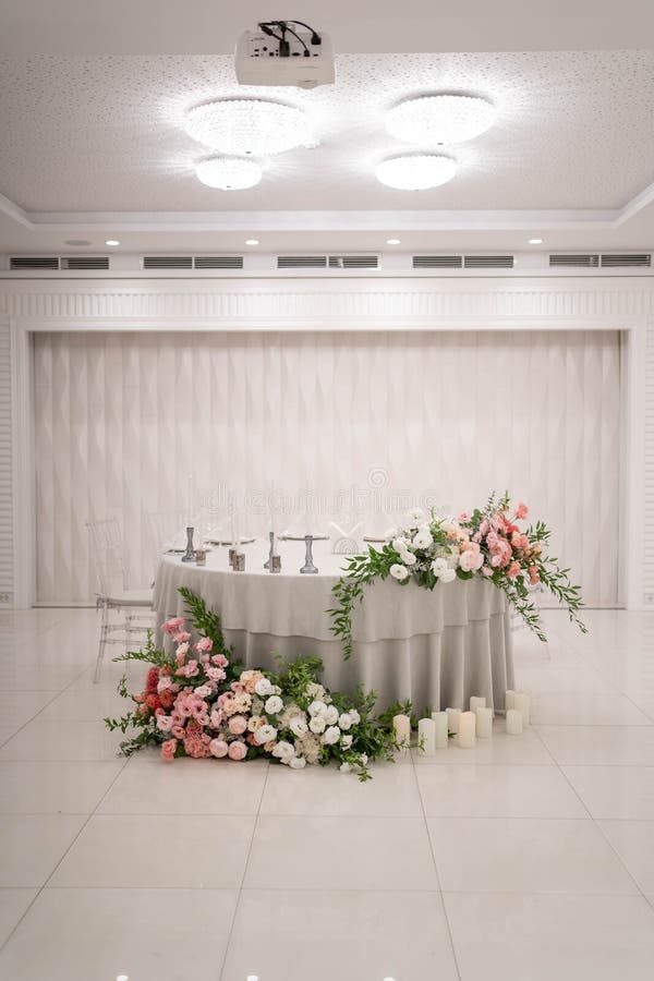 Main Table at a Wedding Reception with Beautiful Fresh Flowers and