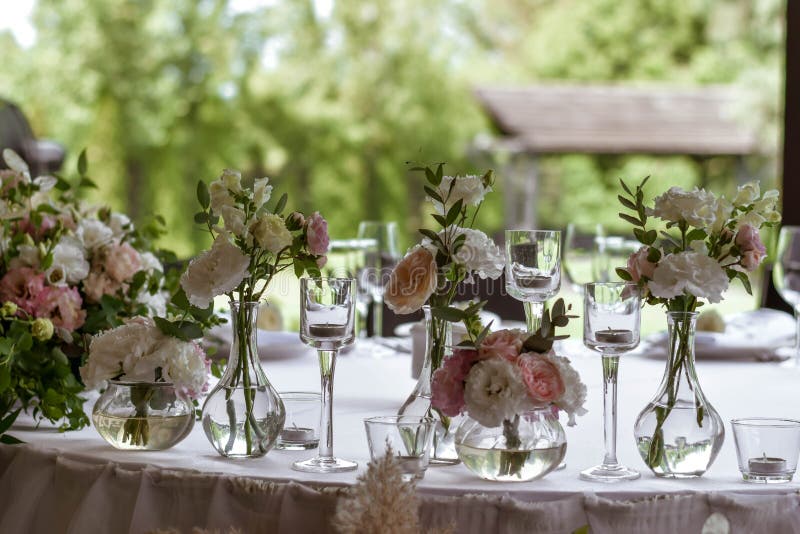 Main Table at a Wedding Reception with Beautiful Fresh Flowers Stock