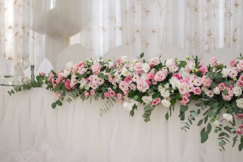 Main Table at a Wedding Reception with Beautiful Fresh Flowers Stock