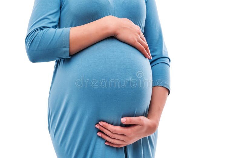 Mains de prise de femme enceinte sur le ventre Plan rapproché image libre de droits Mains de prise de femme enceinte sur le ventre Plan rapproché image libre de droits