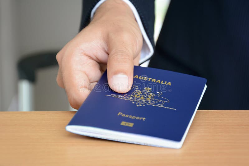 Hands giving passport of Australia. Hands giving passport of Australia
