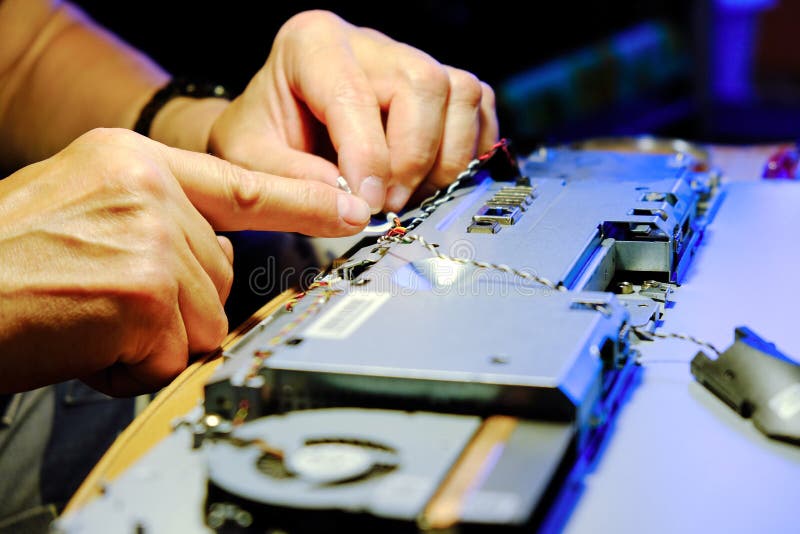 Maintenance of computers. Disconnecting contacts. The wizard replaces the RAM, increasing the performance of the computer. Electronic engineer of computer technology. Maintenance computer cpu hardware upgrade of motherboard component. Pc repair, technician and industry support concept.