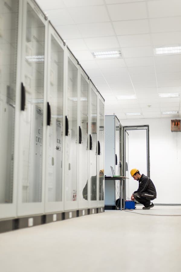 Maintenance engineer inspect system with relay test set equipment stock images