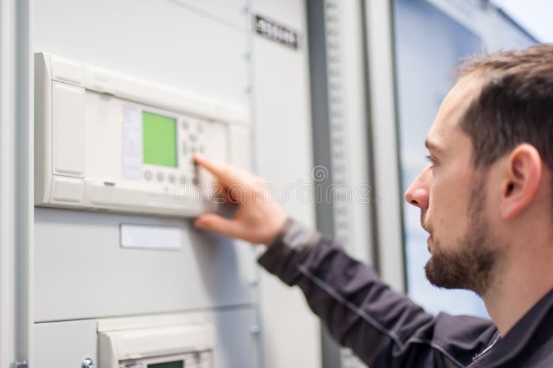 Maintenance engineer testing voltage switchgear and bay control royalty free stock image