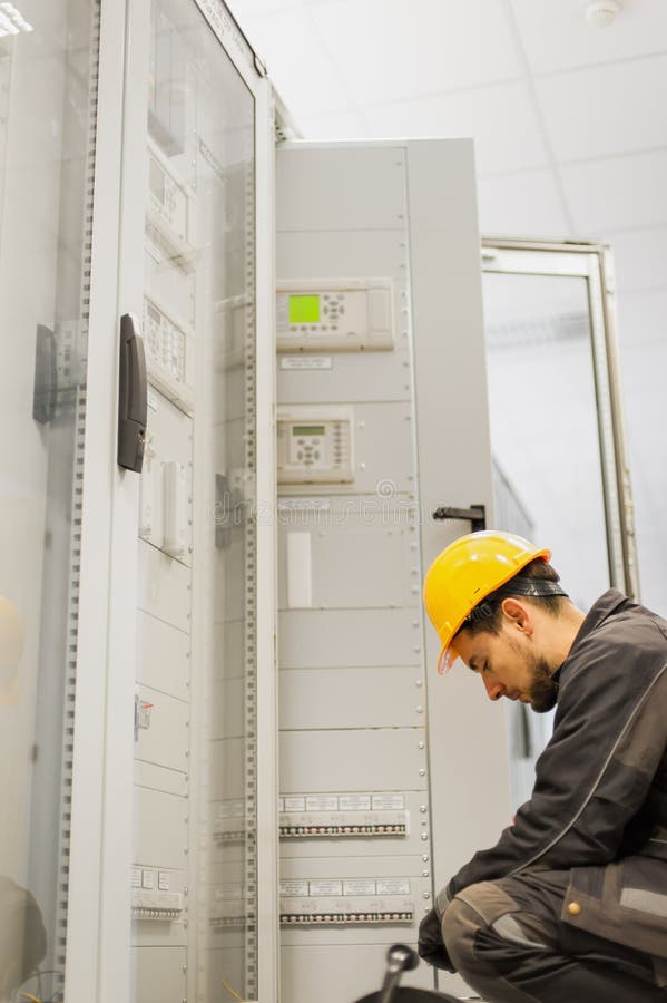 Maintenance engineer testing voltage switchgear and bay control royalty free stock photo