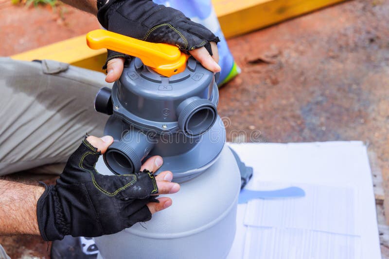 Maintenance Worker Assembles Sand Filter System Tank, a Equipment Used