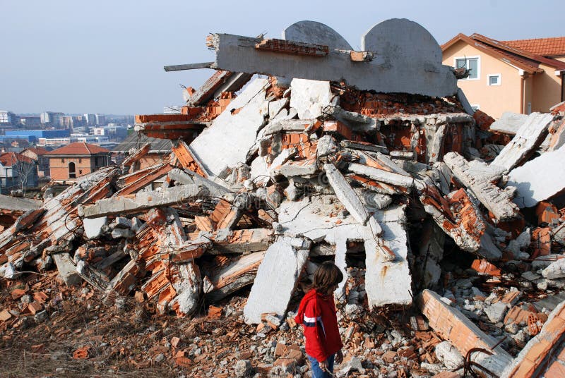 Little girl near demolished building. Little girl near demolished building