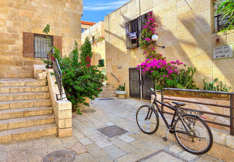 Bicycle on narrow street among typical stoned houses of jewish quarter in Old City of Jerusalem, Israel. Bicycle on narrow street among typical stoned houses of jewish quarter in Old City of Jerusalem, Israel.