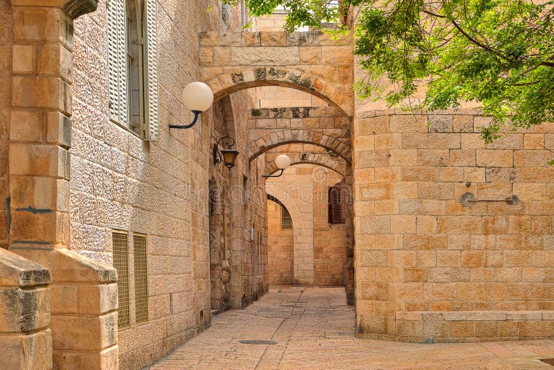 Narrow cobbled street among traditional stoned houses of jewish quarter at old historic part of jerusalem, Israel. Narrow cobbled street among traditional stoned houses of jewish quarter at old historic part of jerusalem, Israel.