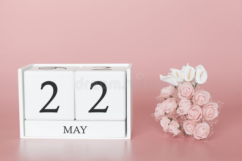 May 22nd. Day 22 of month. Calendar cube on modern pink background, concept of bussines and an importent event