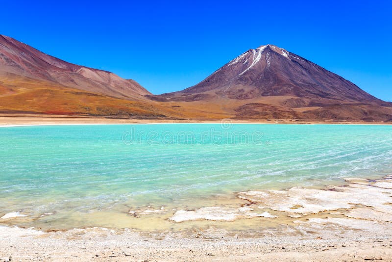 The majestic Laguna Verde or Green Lagoon in the altiplano of Bolivia with the Licancabur volcano in the background near the Salar