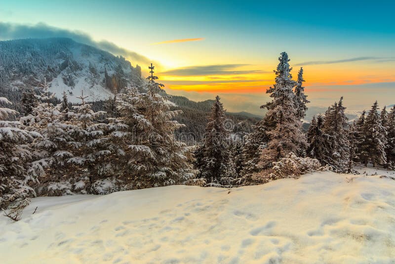 Beautiful winter landscape at sunrise in the mountains,Carpathians,Transylvania,Romania,Europe. Beautiful winter landscape at sunrise in the mountains,Carpathians,Transylvania,Romania,Europe