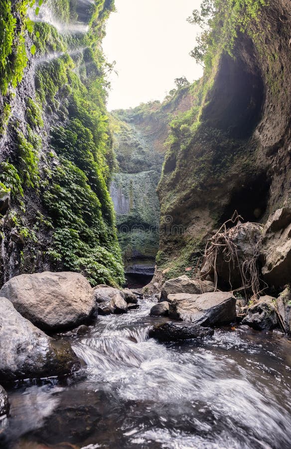 Majestic Waterfall Flowing On Rocky Cliff In Tropical Rainforest Stock