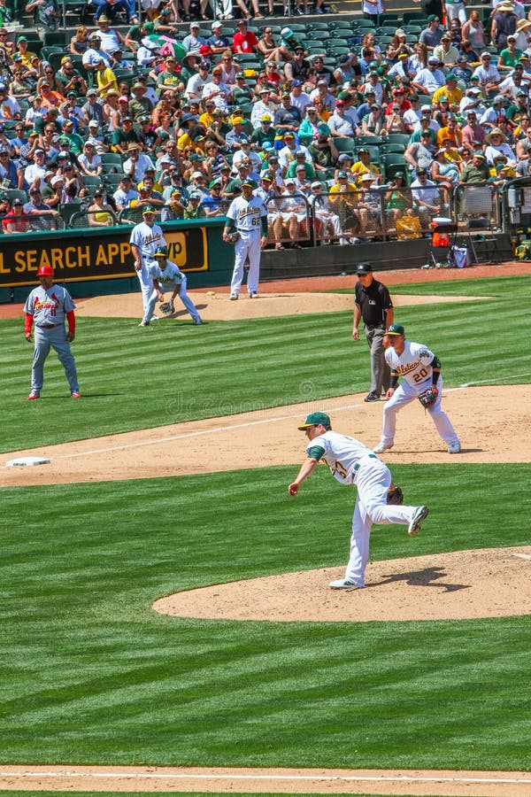 Oakland As starting pitcher Tommy Milone gets ready to throw a pitch during a Major League Baseball game between the St. Louis Cardinals and the Oakland Athletics in Overstock.com Coliseum in Oakland, California. Oakland As starting pitcher Tommy Milone gets ready to throw a pitch during a Major League Baseball game between the St. Louis Cardinals and the Oakland Athletics in Overstock.com Coliseum in Oakland, California.