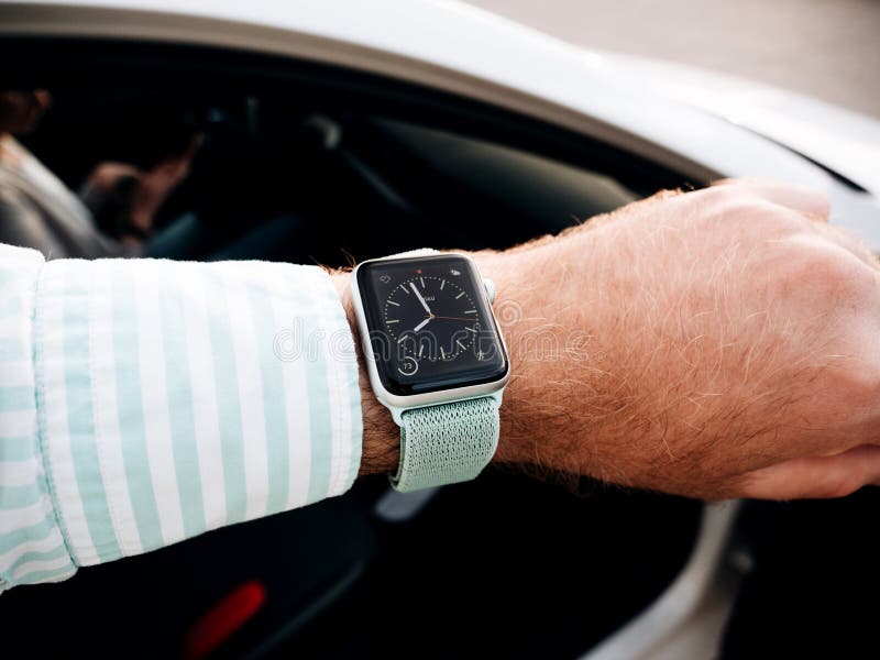 Man checking time on Apple Watch stock photos