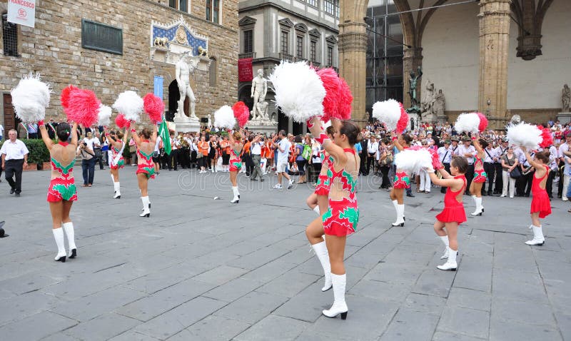 Majorette, cheerleaders on the streets of Florence city in Italy