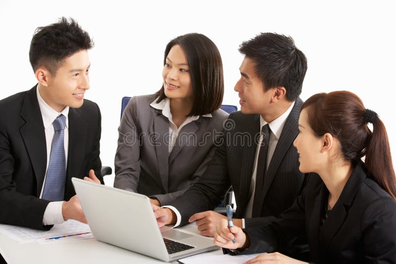 Studio Shot Of Chinese Businesspeople Having Meeting. Studio Shot Of Chinese Businesspeople Having Meeting