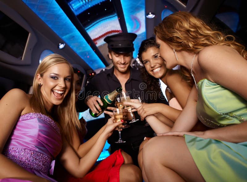 Happy girls having fun in limo, drinking champagne. Happy girls having fun in limo, drinking champagne.