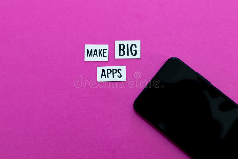 MAKE BIG APPS text on label and pink background with smartphone. Minimal background for companies and startups with women royalty free stock image