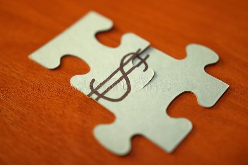 Make money concept. Puzzles puts in dollar sign. dollar sign on two parts of puzzle on wooden table. Money, capital, business. royalty free stock photos Make money concept. Puzzles puts in dollar sign. dollar sign on two parts of puzzle on wooden table. Money, capital, business. royalty free stock photos