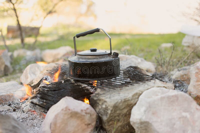 Tea Kettle on Open Fire. Tea in the Camping Stock Image - Image of