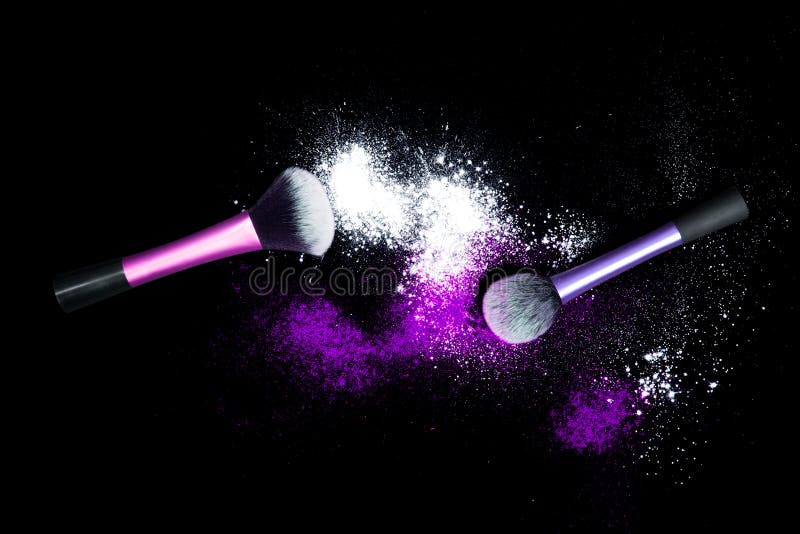 Make-up brush with white powder spilled glitter dust on black background. Makeup brush on new year`s Party with bright colors.