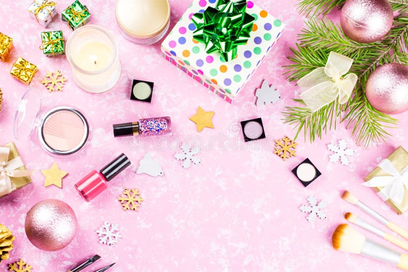 Make Up Cosmetics, Presents and Christmas Decorations on Artistic Pink ...