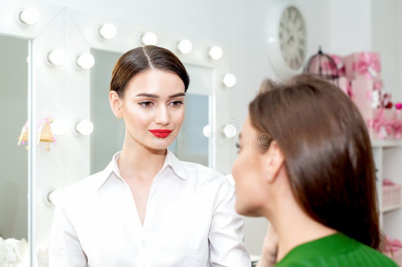 Makeup Artist Looks on Client. Stock Photo Image of fashion, applying