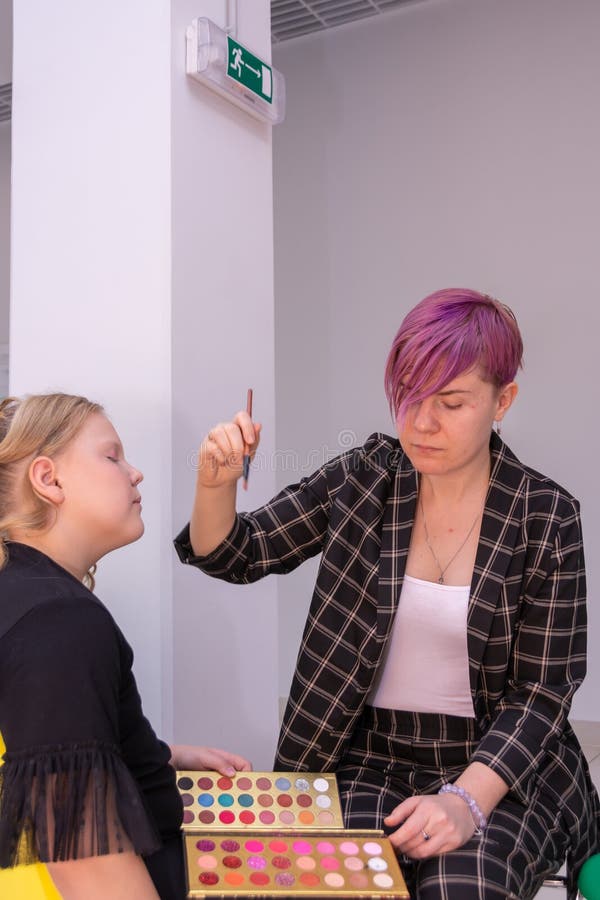 A Makeup Artist Makes Makeup for a Child Editorial Photo Image of