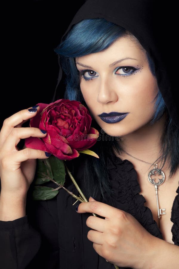 Makeup blue hair woman with black hood cap and rose
