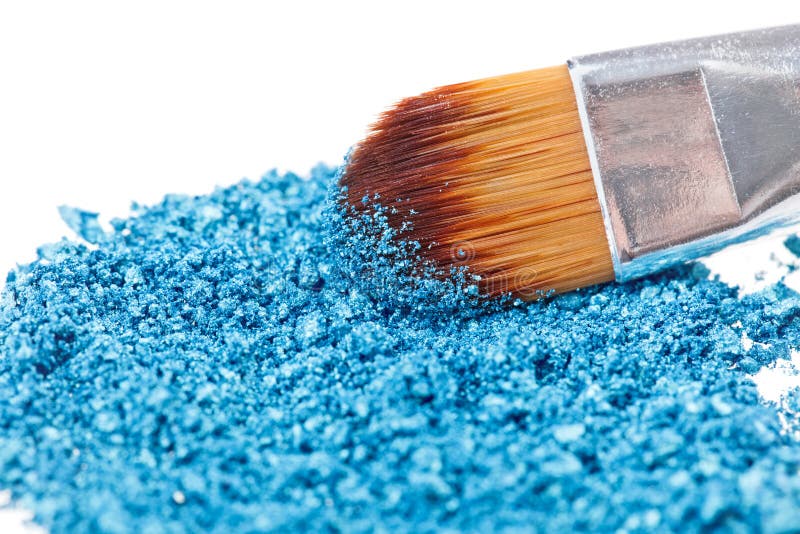 Makeup brush with blue crushed eye shadow stock photos Makeup brush with blue crushed eye shadow stock photos