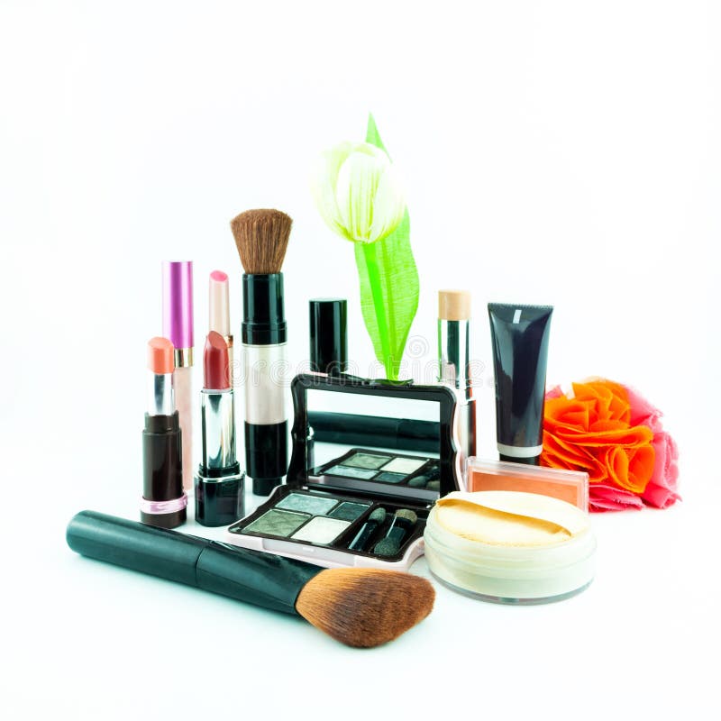 Makeup brush and cosmetics set on a white background