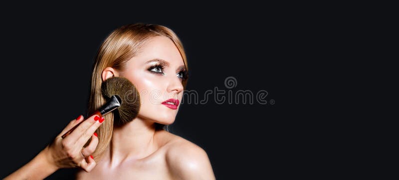 Makeup in process. Female portrait isolated on black. Fashion make up, cosmetic. Girl with makeup, red lips. Closeup stock photography Makeup in process. Female portrait isolated on black. Fashion make up, cosmetic. Girl with makeup, red lips. Closeup stock photography