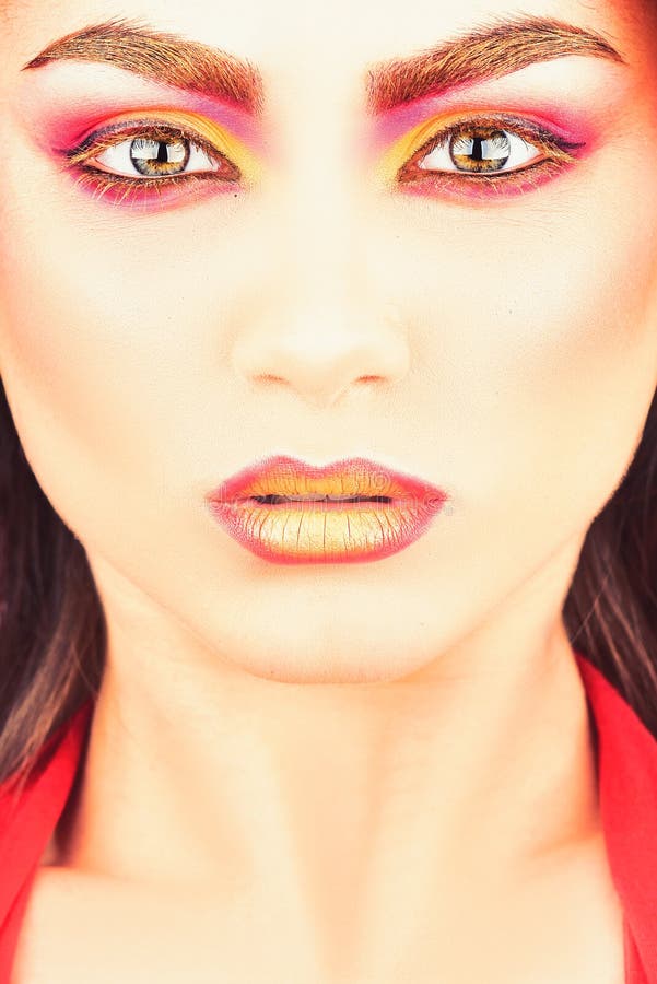 Makeup is a womans secret. Pretty woman wear colorful makeup. A beauty of a girl. Sexy woman with creative makeup stock photo Makeup is a womans secret. Pretty woman wear colorful makeup. A beauty of a girl. Sexy woman with creative makeup stock photo
